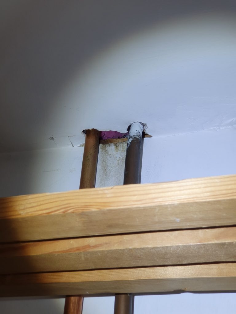 Ingress hole around pipework used by rats to travel up through property in East Sussex Ingress hole around pipework used by rats to travel up through property
