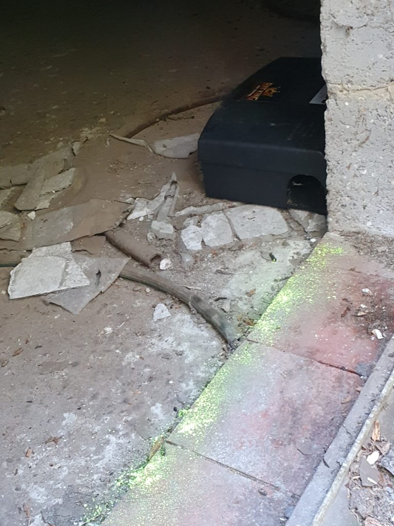 Tracking dust at entrance of garage with a rat infestation Tracking dust placed at entrance to garage